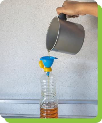 Owner collecting old oil for recycling 